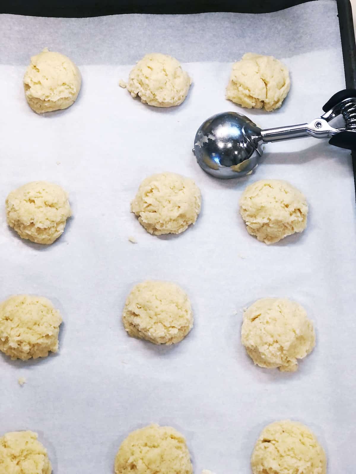 scooping ricotta cookie dough