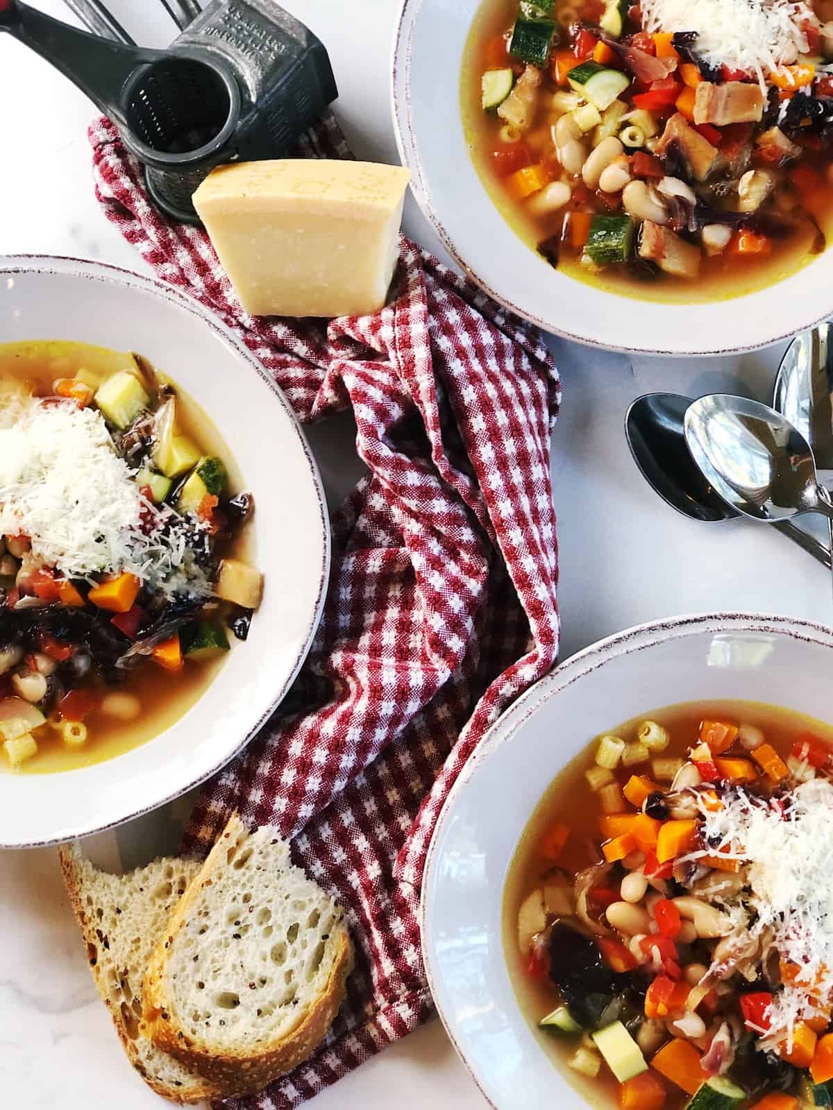 Italian minestrone soup in bowls on a table