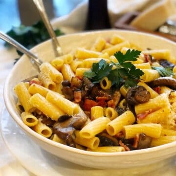 mushroom carbonara in a bowl on the counter.