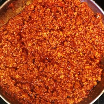 ragu alla bolognese in a large pan.