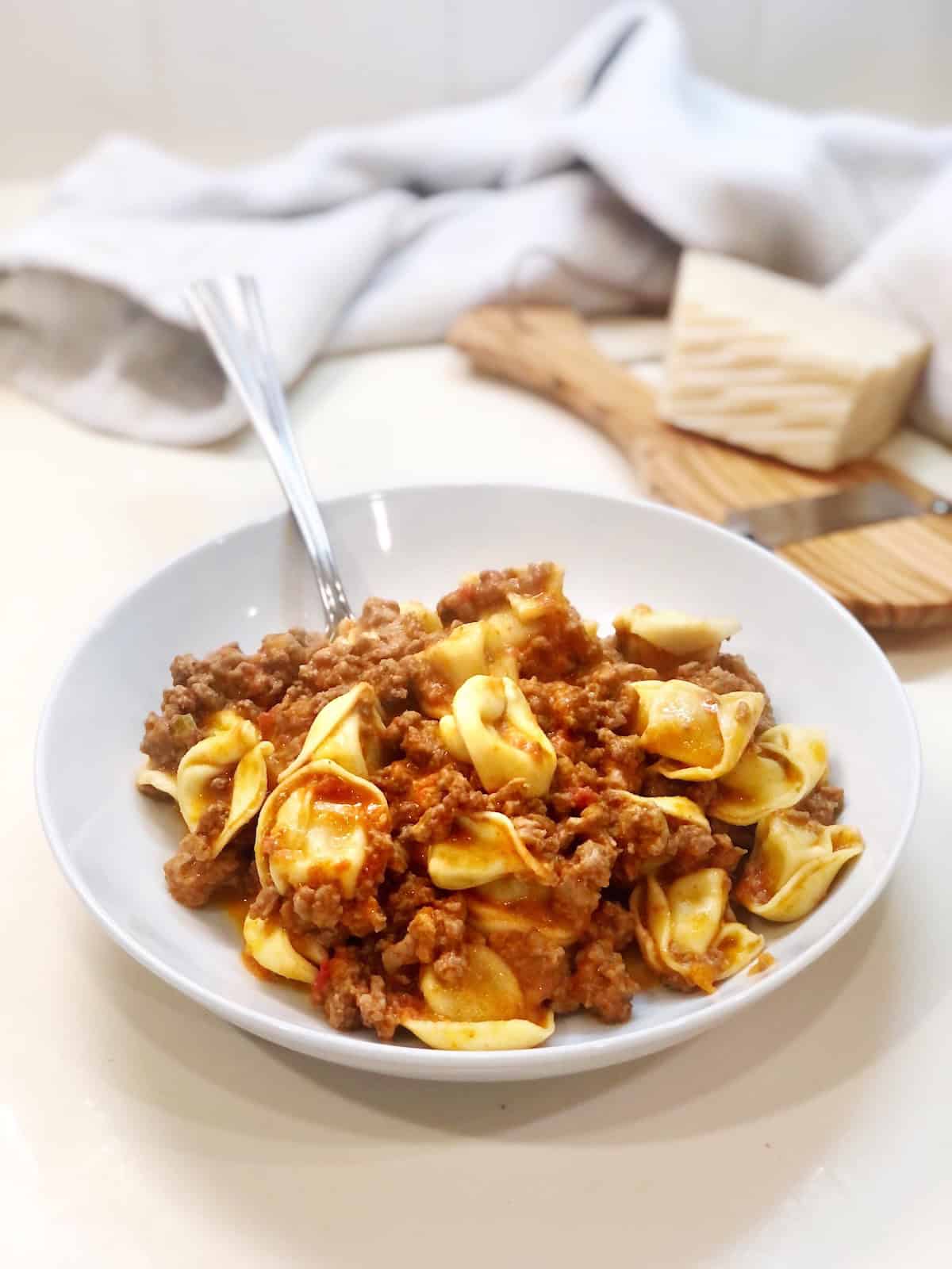 The creamy tortellini Bolognese in a bowl.