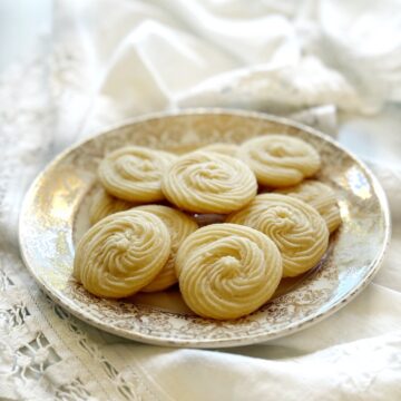 Closeup of swirled shortbread cookies on a plate.