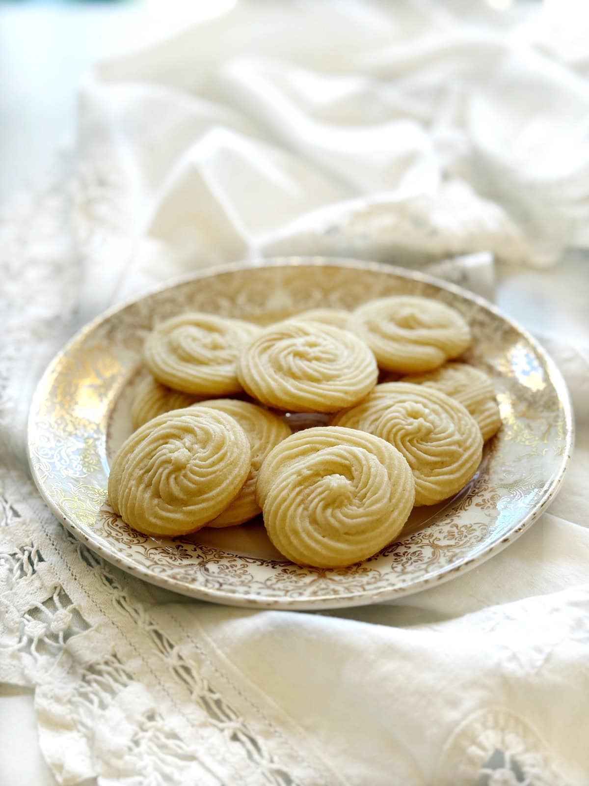 Closeup of swirled shortbread cookies on a plate.