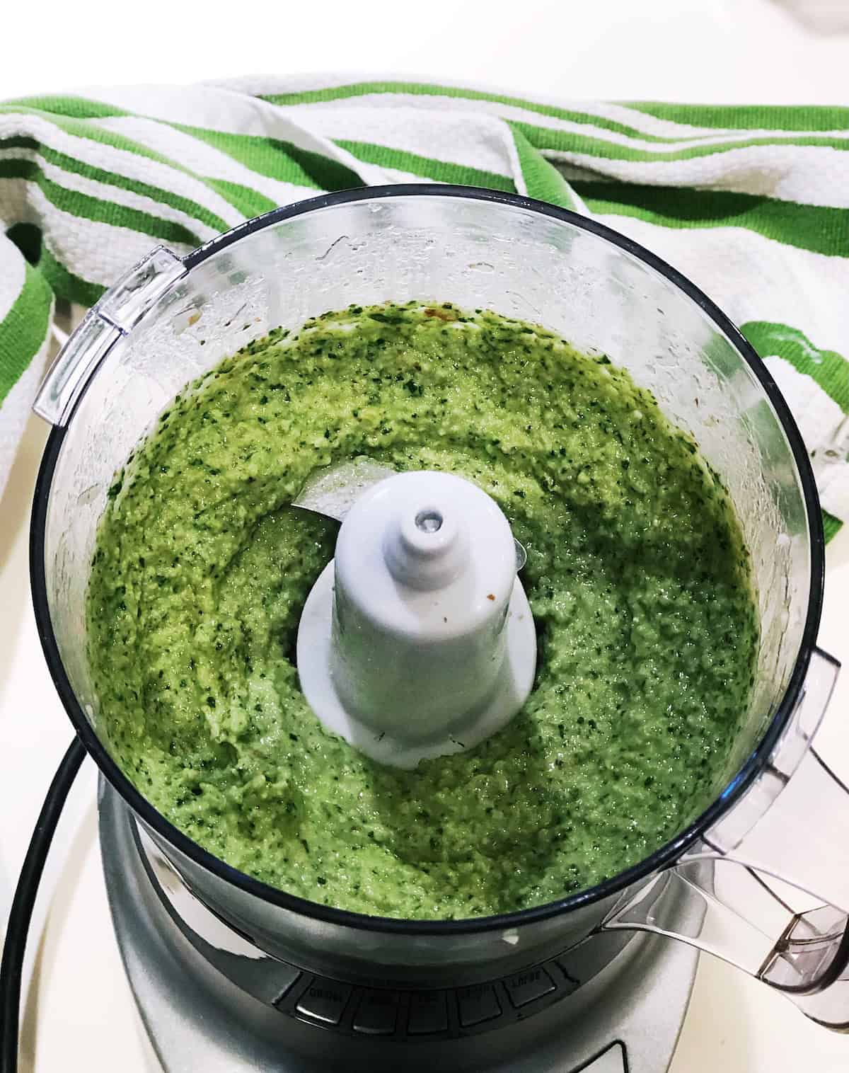 Blending pesto in the food processor.