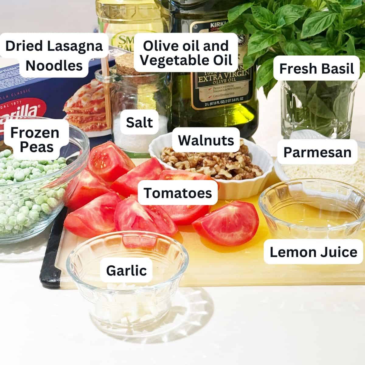 Pasta, pesto and peas dish ingredients.
