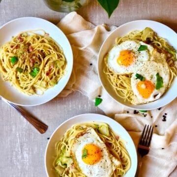 Pasta With Bacon Brussels sprouts and egg in 3 different bowls.