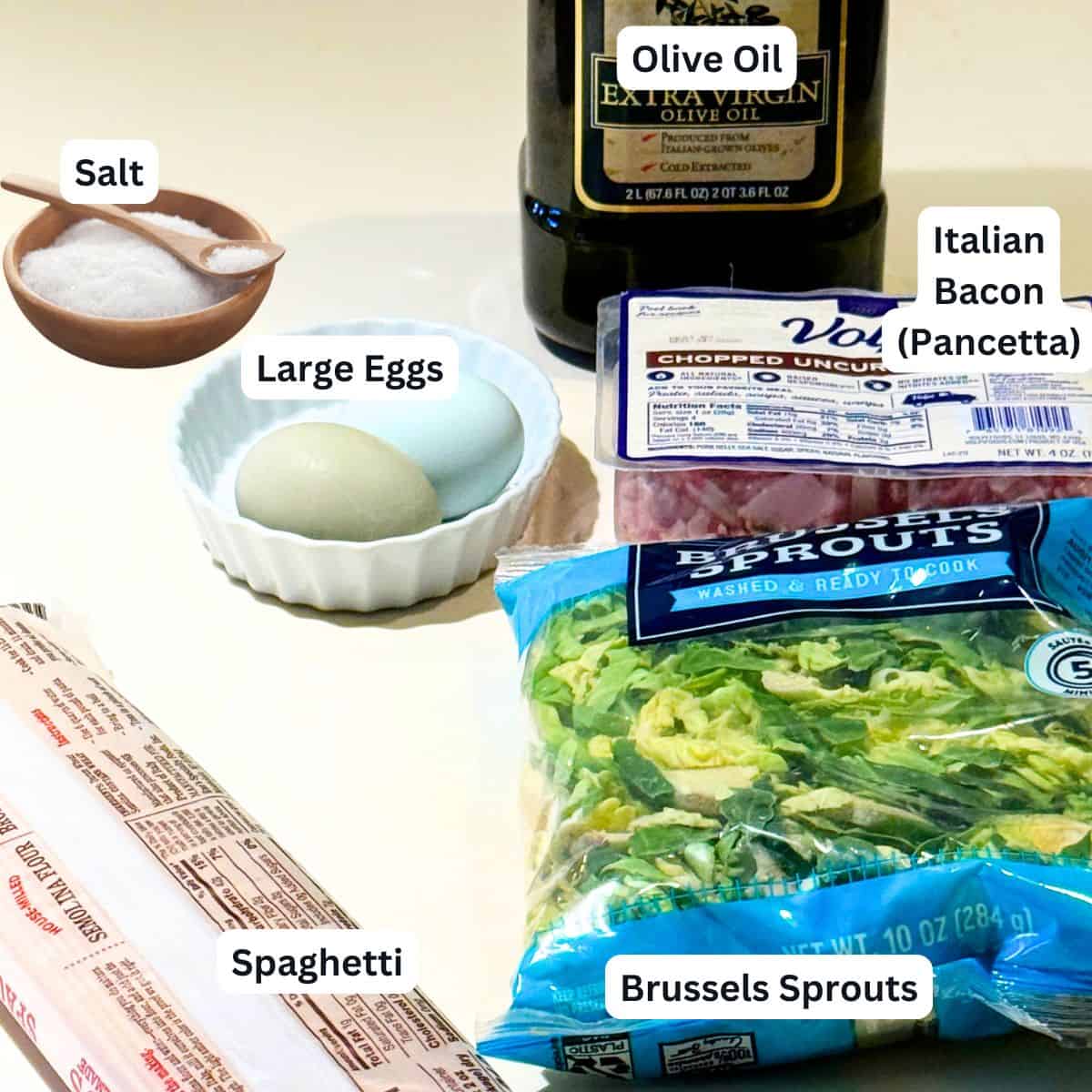 Ingredients for making pasta with Brussels sprouts, bacon and egg.
