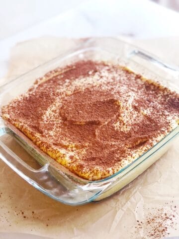 Amaretto tiramisu in a square pan.