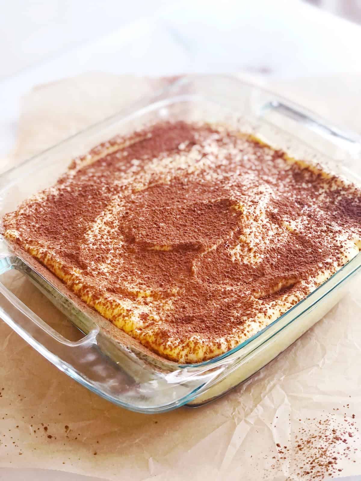 Amaretto tiramisu in a square pan.