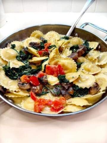 Closeup of the ravioli in mushroom sauce.