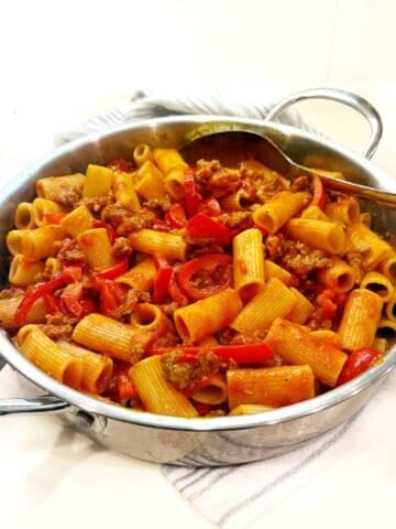 Sausage and peppers pasta in pan.