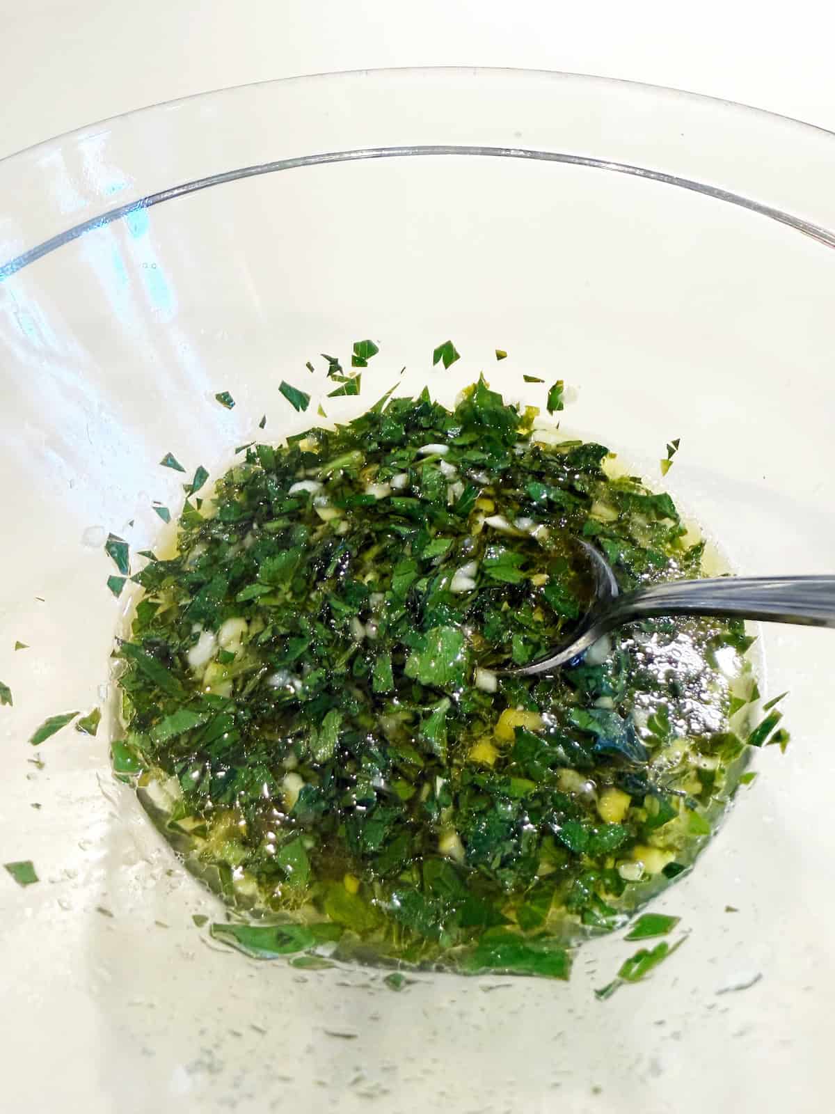 Salmoriglio Sauce in a bowl.