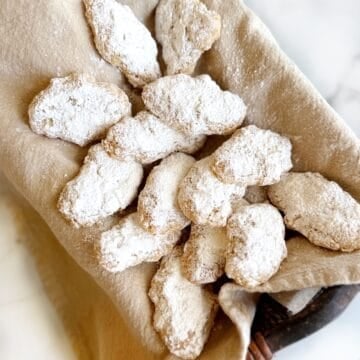 Chewy Italian almond cookies in a basket.