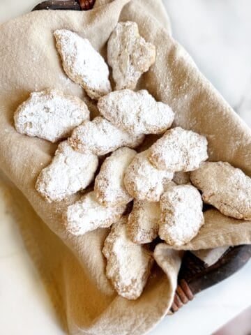 Chewy Italian almond cookies in a basket.